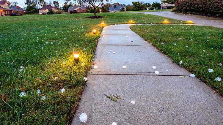 Hail covering a road.