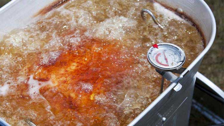 Safely frying a turkey in a deep fryer.