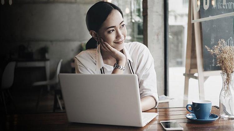 Woman sitting at laptop..